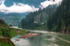 landscapes of Kashmir with beautiful river island and red huts in the neelam valley